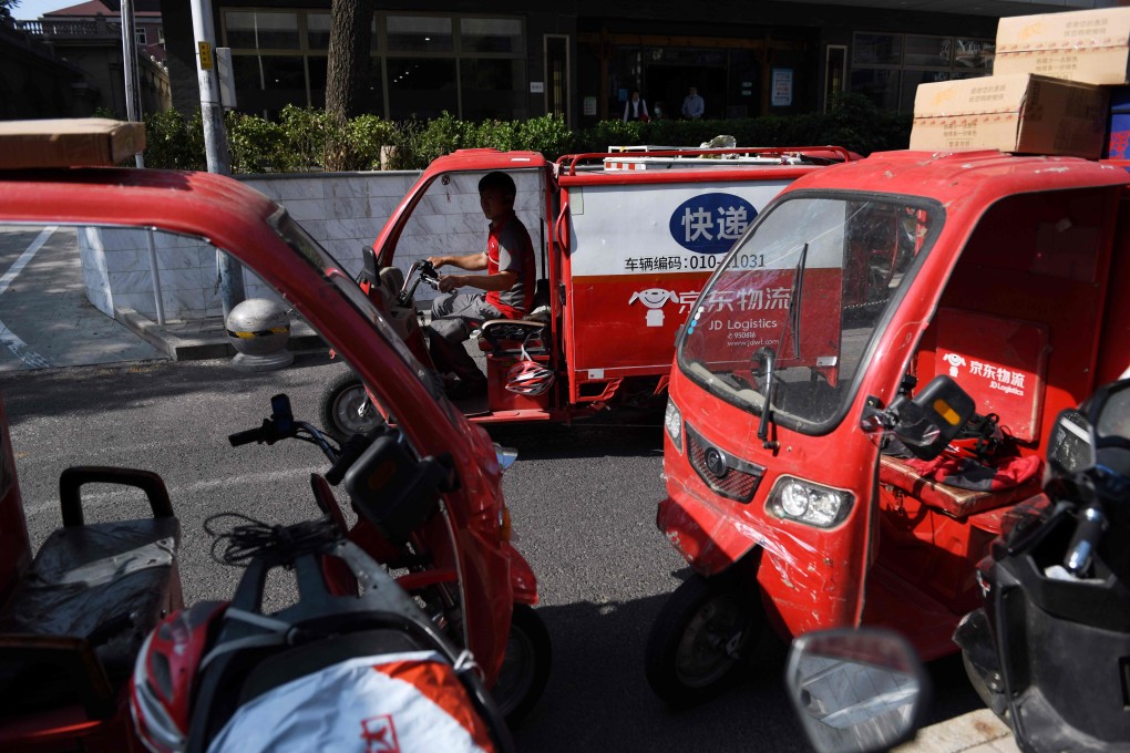 A JD.com delivery driver leaves a depot in Beijing. Photo: Agence France-Presse