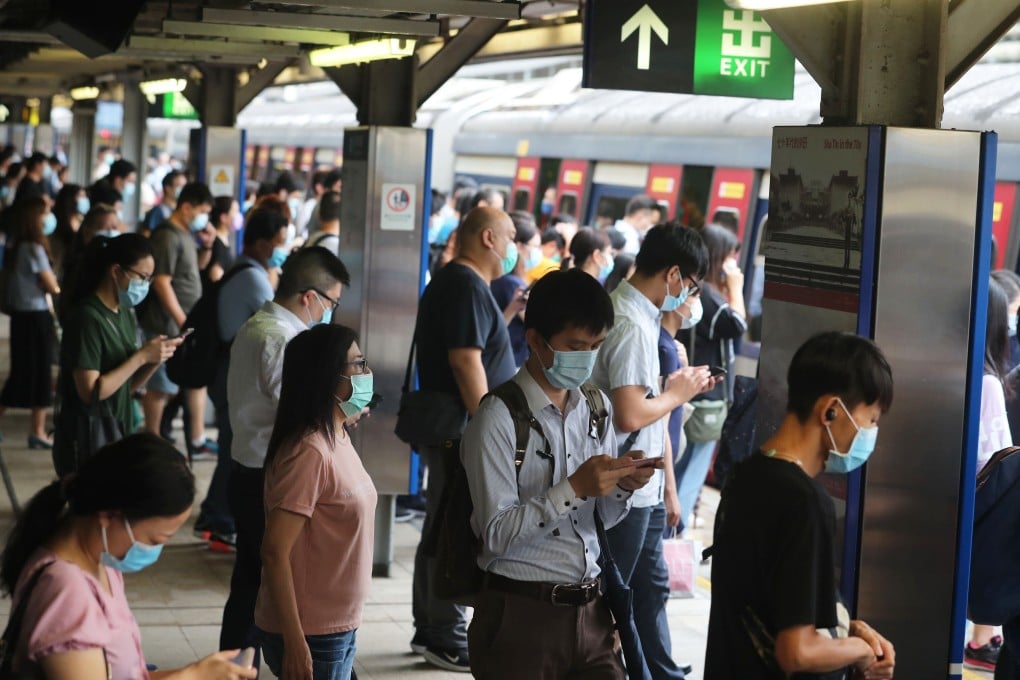 Commuters at Hong Kong’s Tai Tai Station prepare to board a train after resumption of services after the Observatory lowered the typhoon signal to No 3. Photo: Sam Tsang