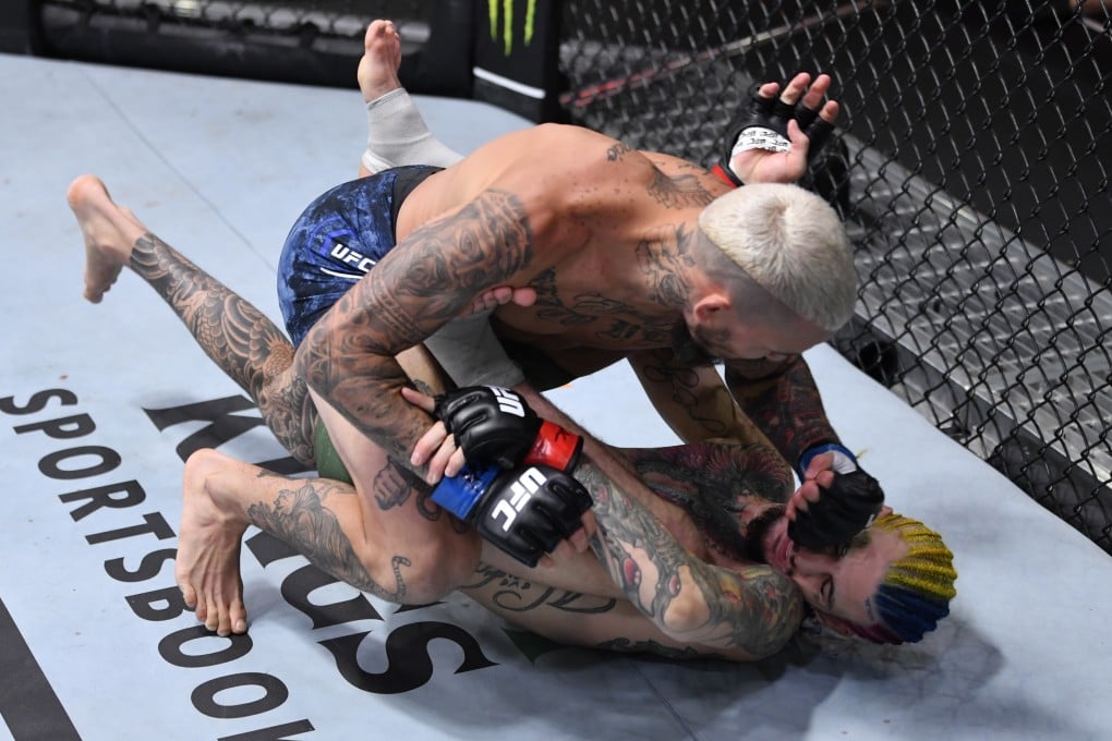 Marlon Vera punches Sean O’Malley in their bantamweight bout during UFC 252. Photo: Jeff Bottari/Zuffa LLC