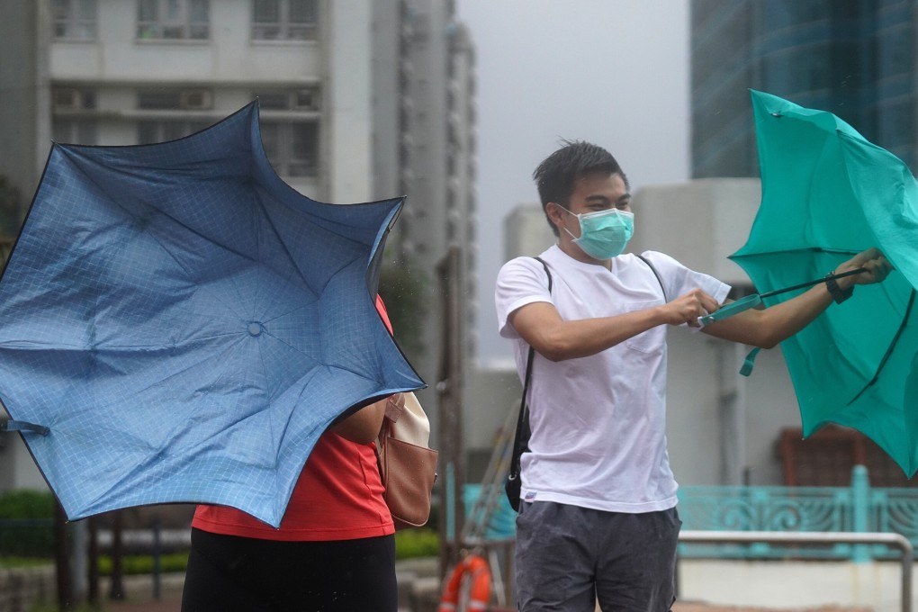 Pedestrians struggle with their umbrellas as storm Higos closes in on Hong Kong. Photo: Winson Wong