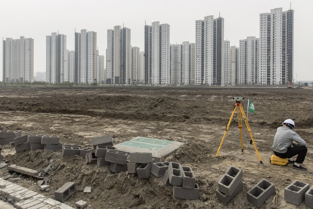 A surveyor sits on a construction site in Ningbo, China, on April 26, 2020. Local governments have long offered firms connected to China’s political elite land sale discounts. Photo: Bloomberg