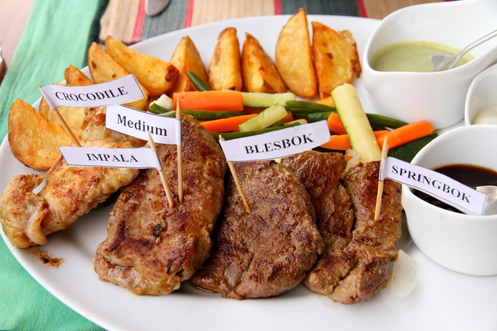 A plate of African game meats – crocodile, impala, blesbok and springbok. Somkhanda game reserve in South Africa is keeping itself afloat by selling impala and nyala meat. Photo: Shutterstock