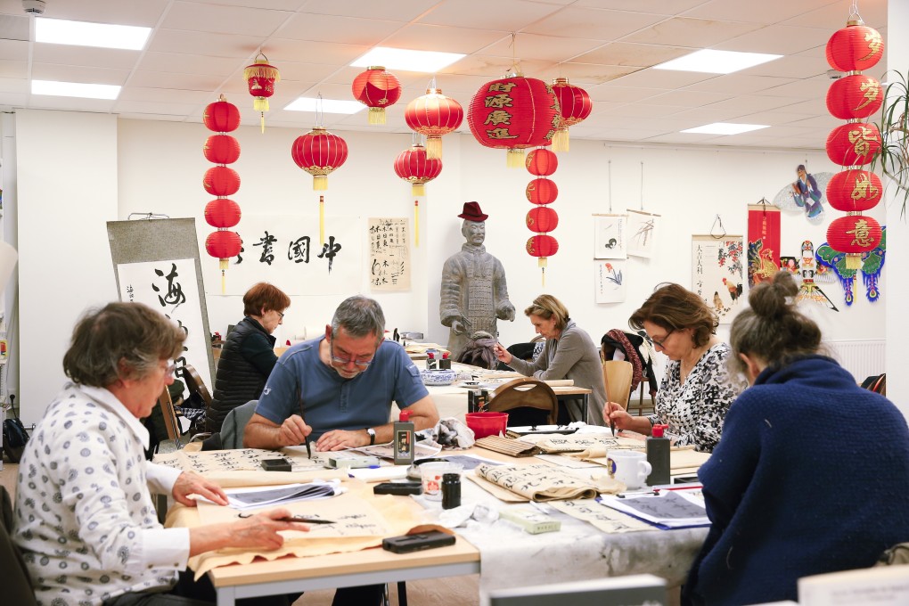 Students write Chinese calligraphy at the Confucius Institute in Brussels, Belgium, in this 2017 file photo. Photo: Xinhua