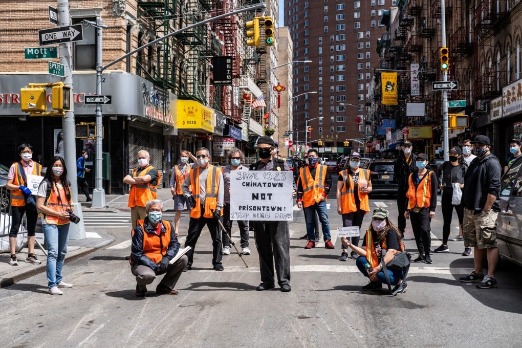 Volunteers from the Chinatown Block Watch neighbourhood patrol group pose for pictures in New York in May, amid a spike in hate crimes in the city. Photo: Reuters