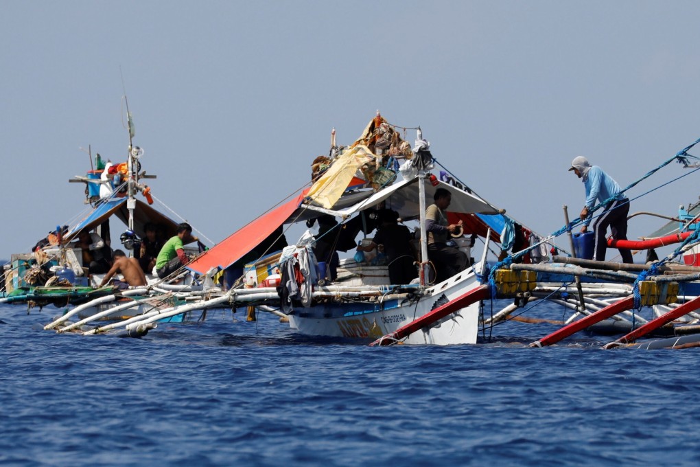Filipino fishermen at the disputed Scarborough Shoal. File photo: Reuters