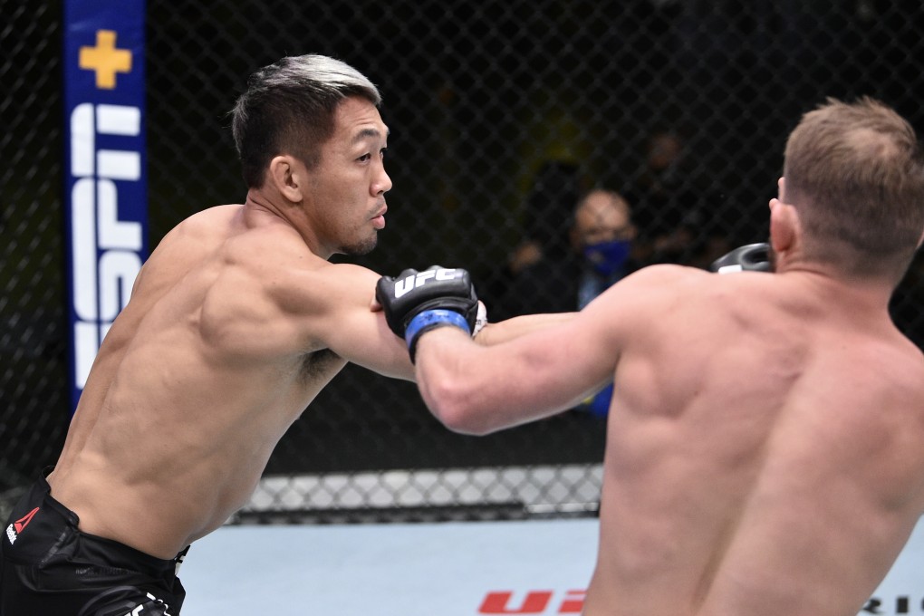 Takashi Sato punches Jason Witt during UFC Fight Night at the UFC Apex. Photo: Chris Unger/Zuffa LLC via USA TODAY Sports