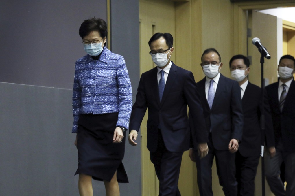 Chief Executive Carrie Lam is followed by her newly appointed principal officials at a press conference on April 22. Photo: AP