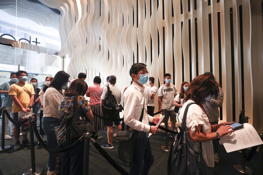 Buyers lining up at the Tsim Sha Tsui sales office of the Seacoast Royale project in Tuen Mun on 22 August 2020. As many as 11,000 people submitted bids for 168 units, or about 66 buyers for every available flat. Photo: Xiaomei Chen