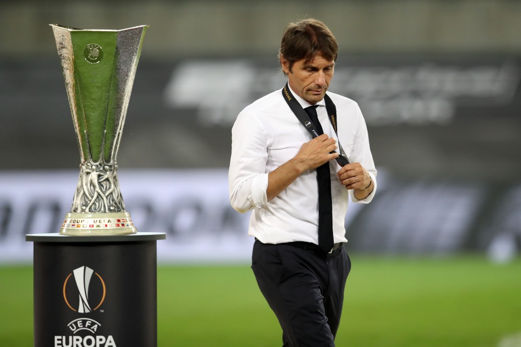 Inter Milan coach Antonio Conte walks past the Uefa Europa League trophy after the final. Photo: Xinhua