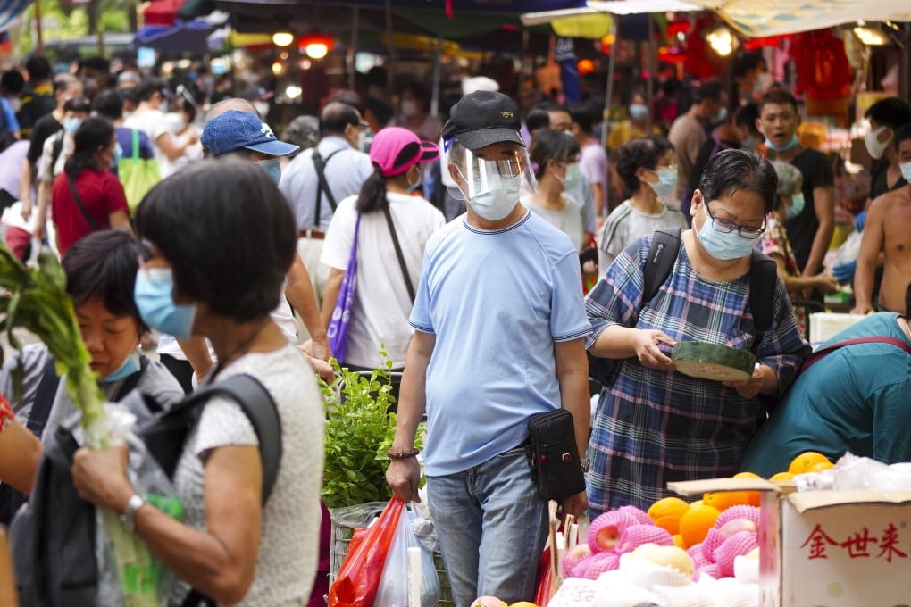 Shoppers in Hong Kong wear protective gear at a market in Mong Kok. Photo: Sam Tsang