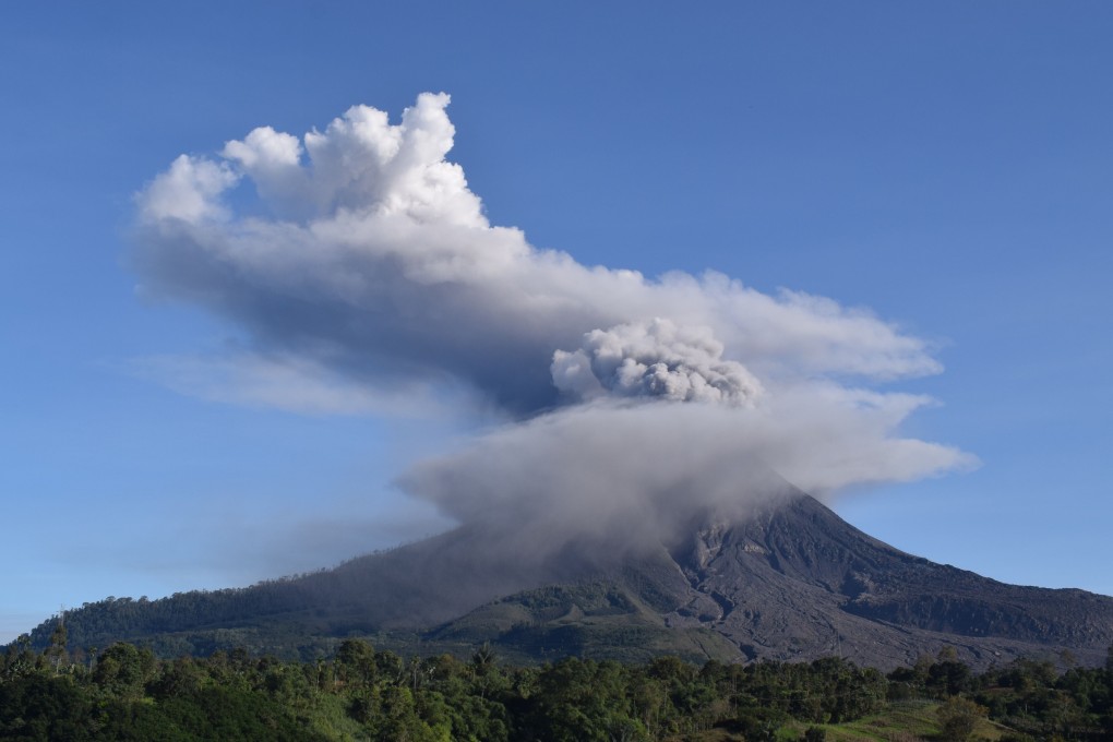 Mount Sinabung spews thick smoke into the air in Karo, North Sumatra. Photo: AFP