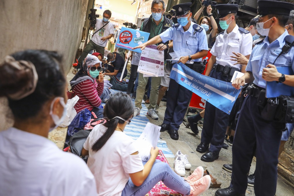 Hong Kong police conduct inspections in Tsuen Wan, asking foreign domestic workers to comply with ongoing Covid-19 social distancing measures. Photo: Dickson Lee