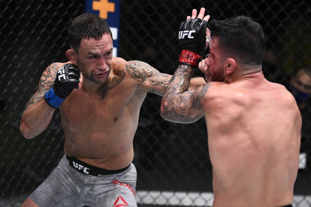 Frankie Edgar punches Pedro Munhoz in their bantamweight fight during the UFC Fight Night event at UFC Apex on August 22, 2020 in Las Vegas, Nevada. Photos: Chris Unger/Zuffa LLC
