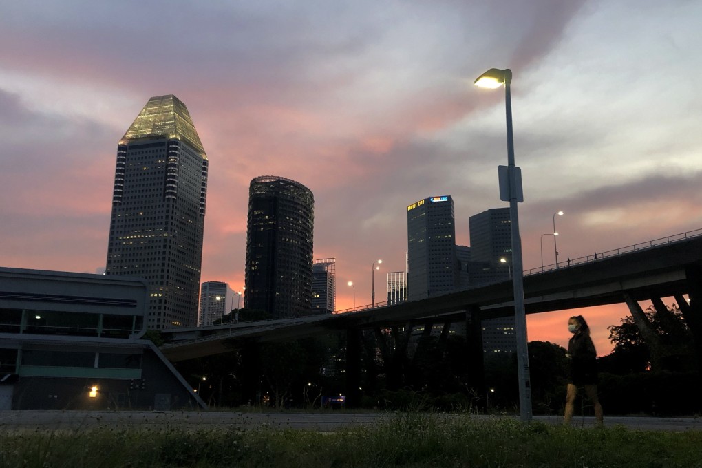 A woman walks alone at dusk in Singapore. Activists say sexual violence and harassment is not taken seriously enough in the country. Photo: EPA-EFE