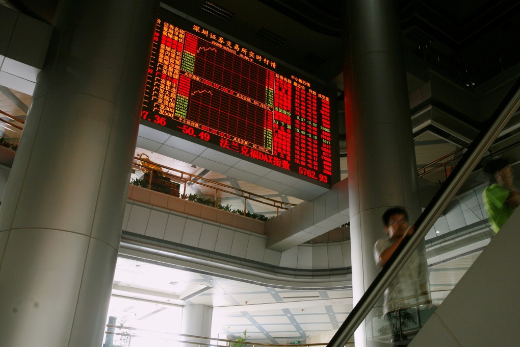A stock board inside the Shenzhen Stock Exchange displays prices. Photo: Reuters