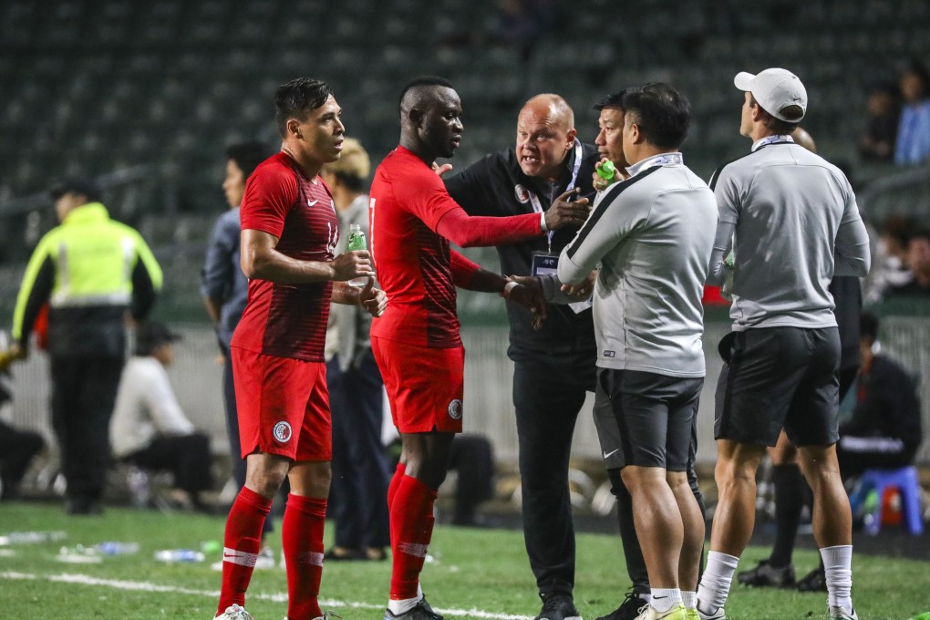 Mixu Paatelainen (in black) gives instructions to his players at a 2022 World Cup Asian zone qualifier at Hong Kong Stadium. Photo: May Tse