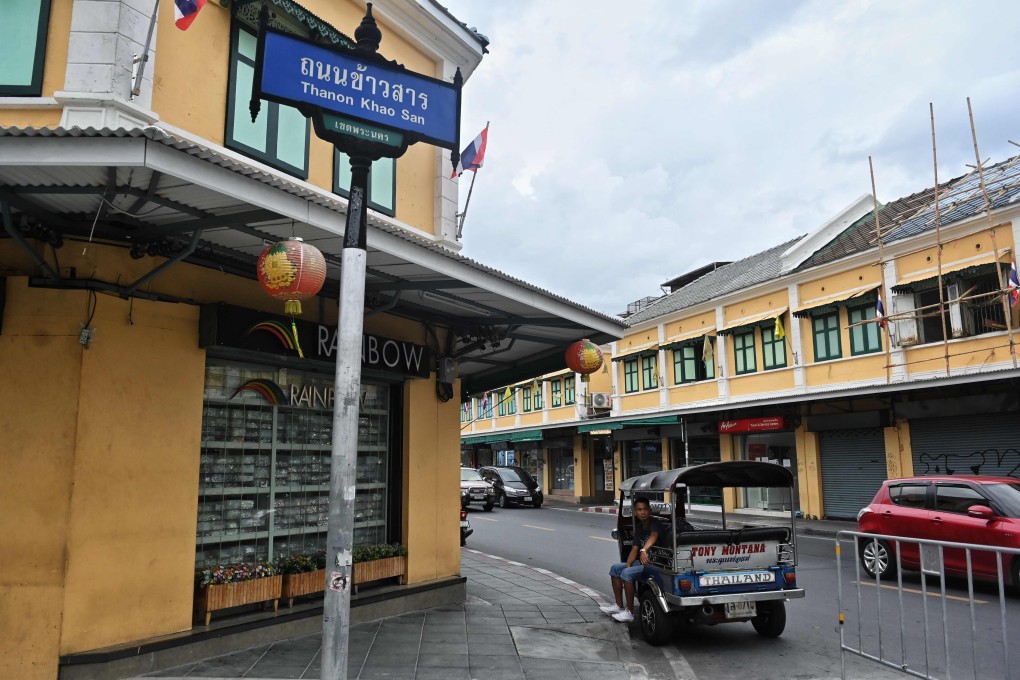 A lone tuk-tuk driver waits for customers on Bangkok’s Khao San Road, empty of tourists amid the Covid-19 pandemic. Photo: AFP