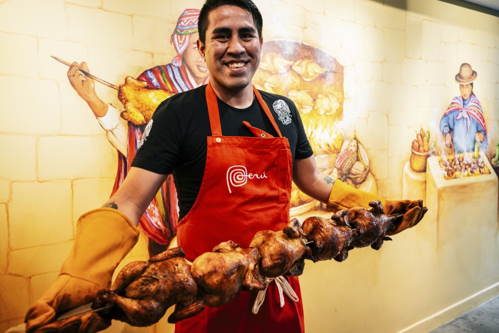 Chullschick chef Abel Ortiz Alvarez holding a skewer of roast chickens. He and fellow South American chefs in Hong Kong Agustin Balbi and Ricardo Chaneton extol the pleasures of their countries’ cuisines. Photo: Rose Chiu