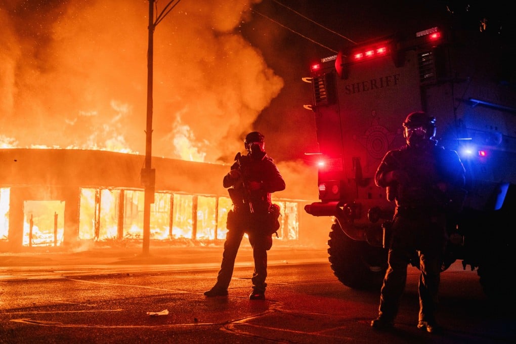 A police armoured vehicle is seen in Kenosha, Wisconsin, on the second night of violent protests following the police shooting of Jacob Blake. Photo: Getty Images via AFP