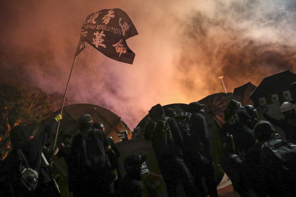 Police and protesters exchange tear gas and petrol bombs during the siege of Chinese University last November in Sha Tin. Photo: Sam Tsang