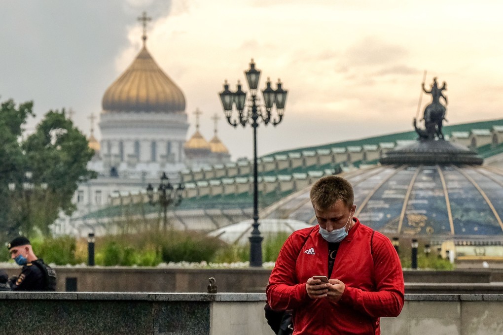 A man wearing a face mask walks in Moscow on Wednesday. Russia has registered the fourth highest Covid-19 caseload in the world. Photo: AFP