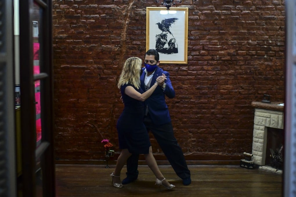 Veronica Pascual (left) and Sergio Saucet, competitors in this year’s Tango World Championships, dance tango in their house in Buenos Aires on August 24. Photo: AFP