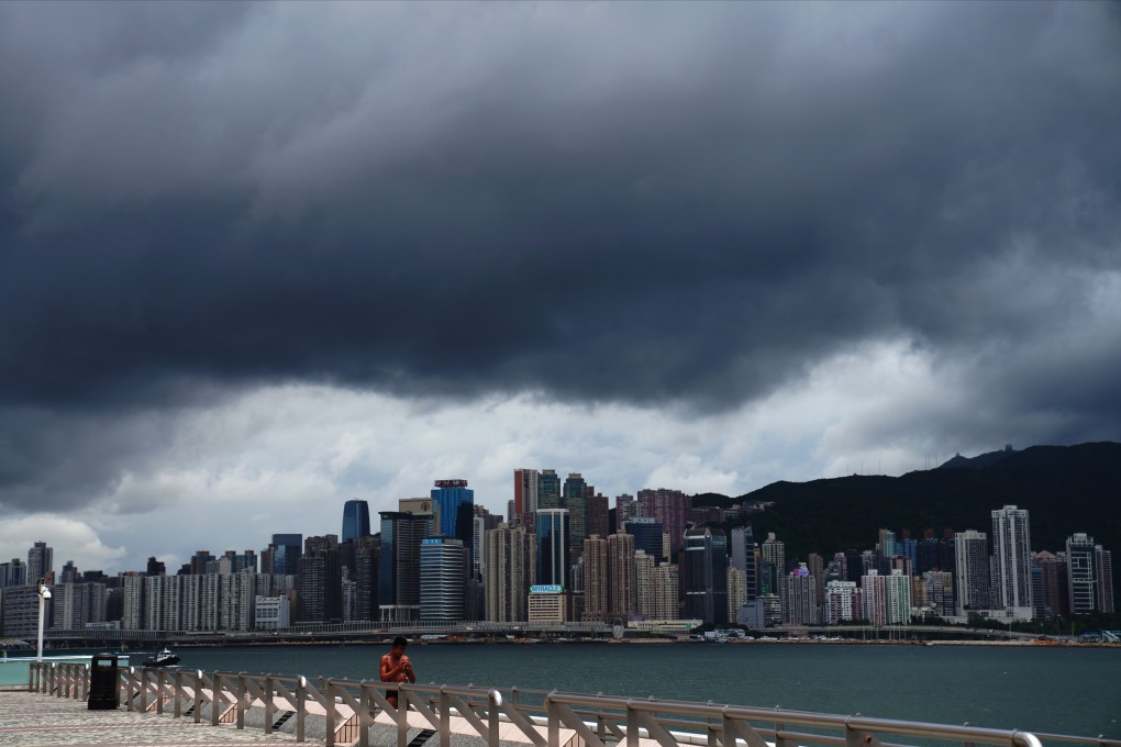 Storm clouds gather above the Hong Kong skyline, as seen from a deserted Tsim Sha Tsui waterfront promenade on August 18. Photo: Sam Tsang