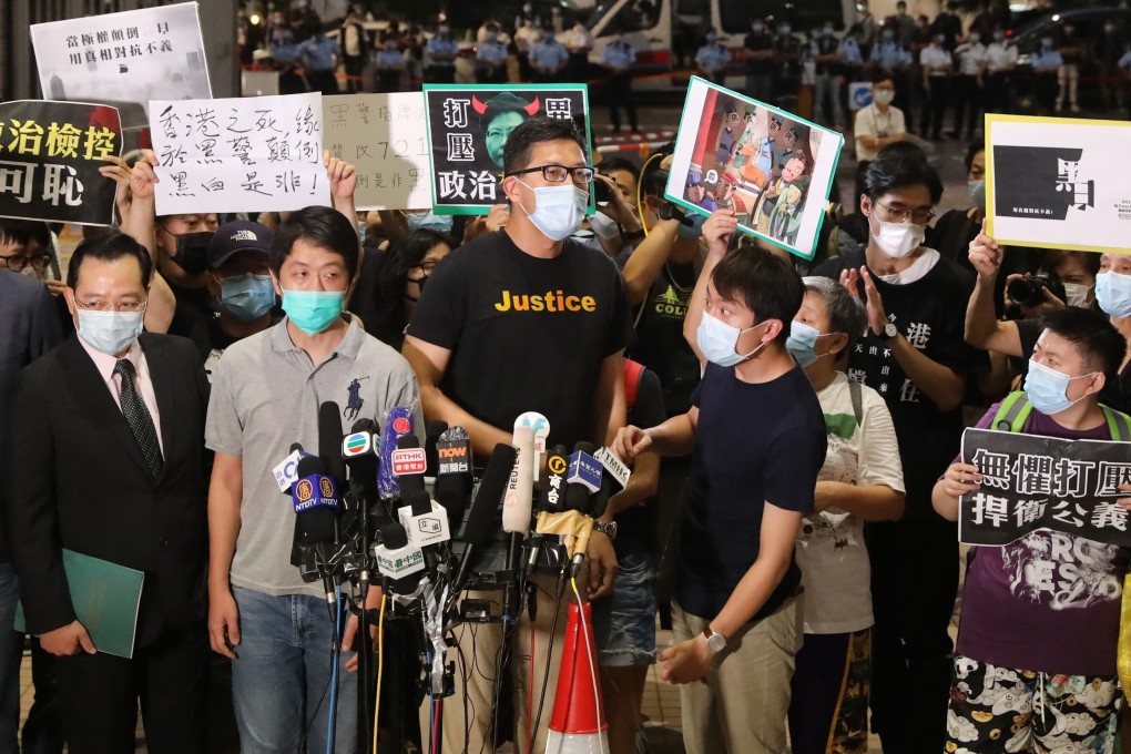 Democratic Party lawmakers Lam Cheuk-ting (centre) and Ted Hui (to his left) outside West Kowloon Court on Thursday. Photo: K.Y. Cheng