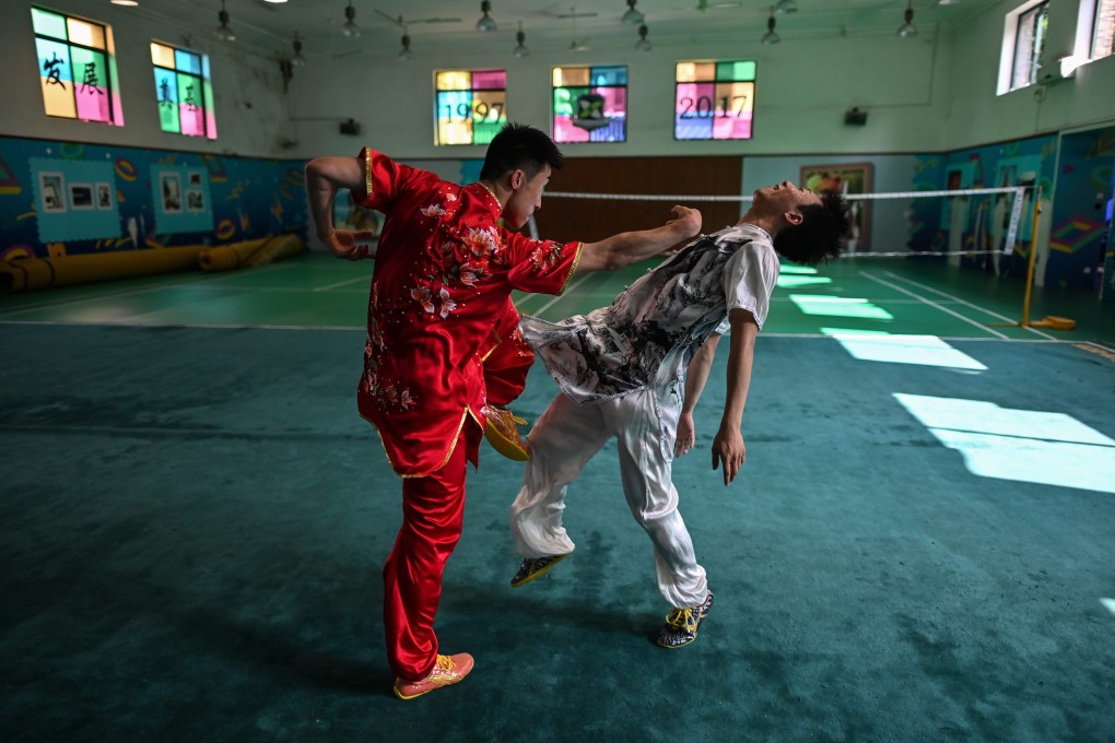 Liu Xuliang (left) practises the art form of drunken boxing with his sparring partner in Shanghai. Photos: AFP