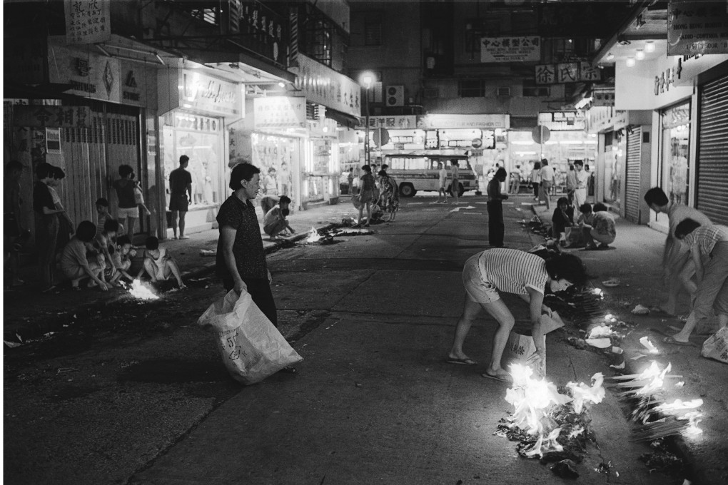 People burn paper offerings and incense on the streets to appease the ghosts during the Hungry Ghosts Festival. Photo: SCMP