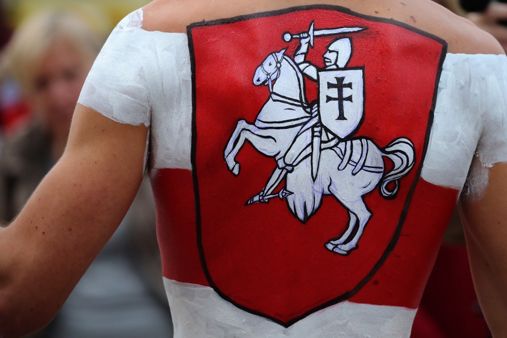 A protester painted with the colours of Belarus’ national flag attends a rally against the results of the presidential elections in Minsk. Photo. EPA