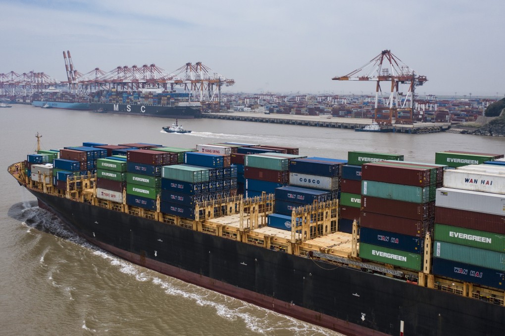A vessel loaded with containers approaches the Yangshan Deepwater Port, off Shanghai, on July 12. China’s exports have exceeded market expectations for five consecutive months. Photo: Bloomberg