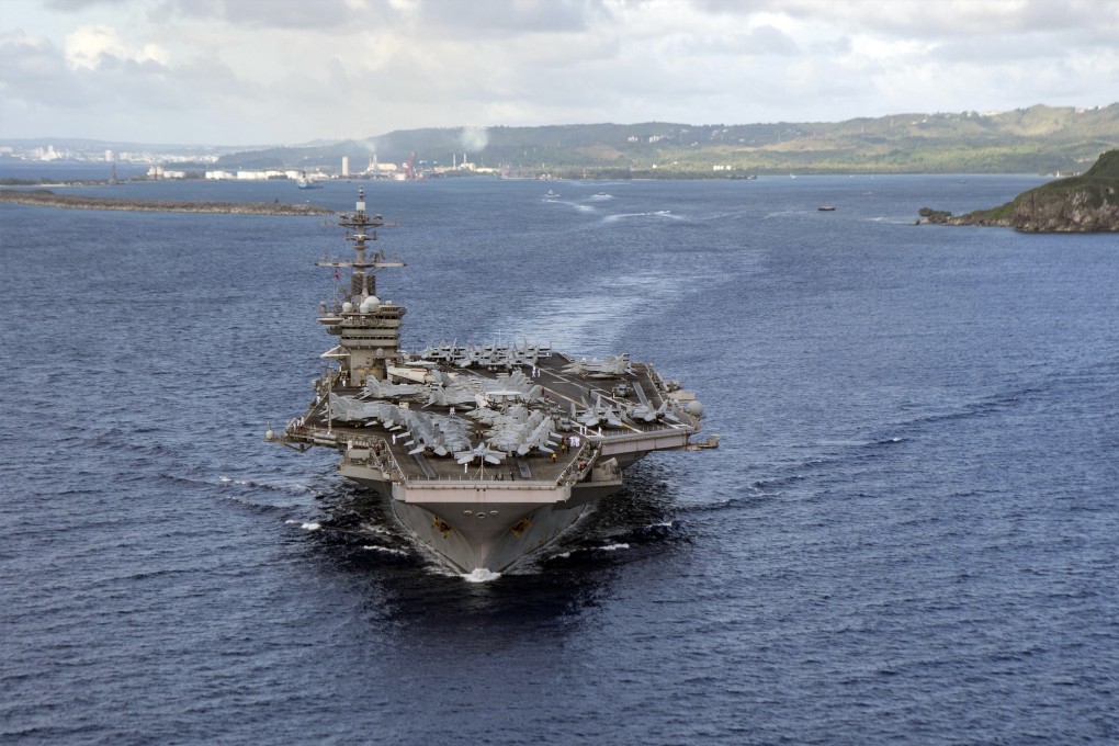 The aircraft carrier USS Theodore Roosevelt departs Guam’s Apra Harbour in June. Photo: US Navy via AP