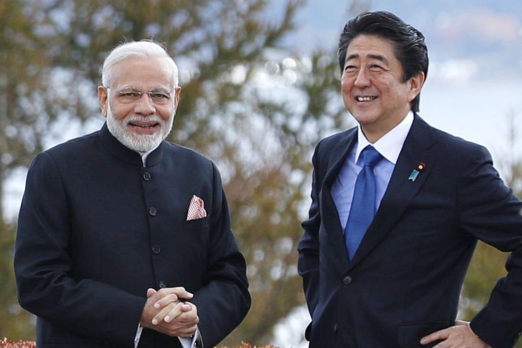 India’s Prime Minister Narendra Modi and Japan’s Prime Minister Shinzo Abe share a light moment in a hotel garden in Yamanakako village, Yamanashi prefecture, Japan, in October 2018. Photo: AP