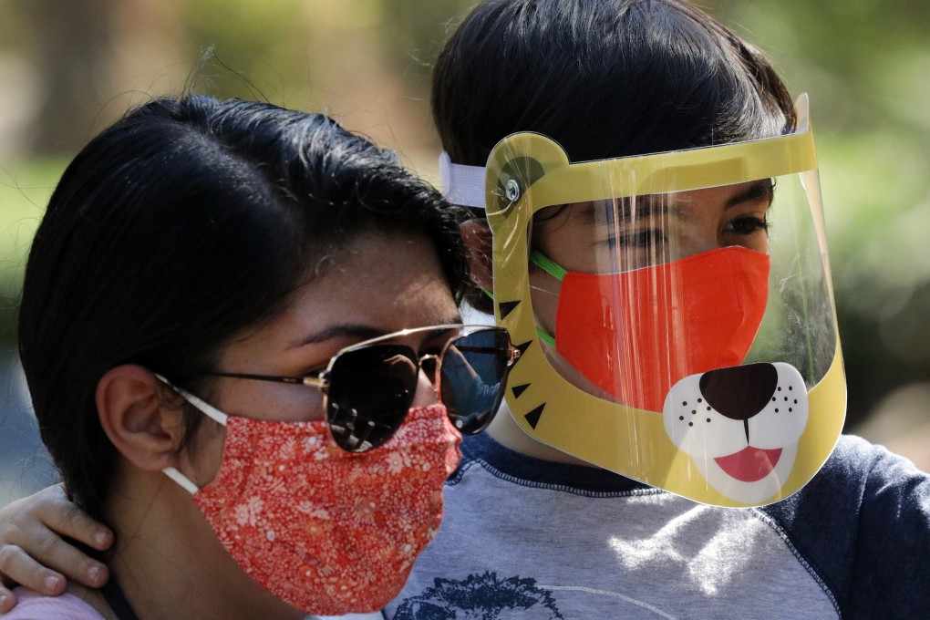 Melanie Olmeda and her six-year-old son Mason Gutierrez visit Los Angeles Zoo after its reopening. Photo: TNS