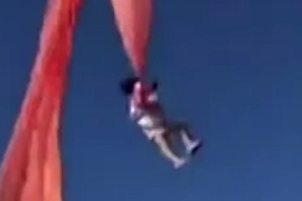 The three-year-old girl, weighing 13kg, is hurled into the air after becoming entangled in the tail of a kite at an international festival in Taiwan. Photo: Handout