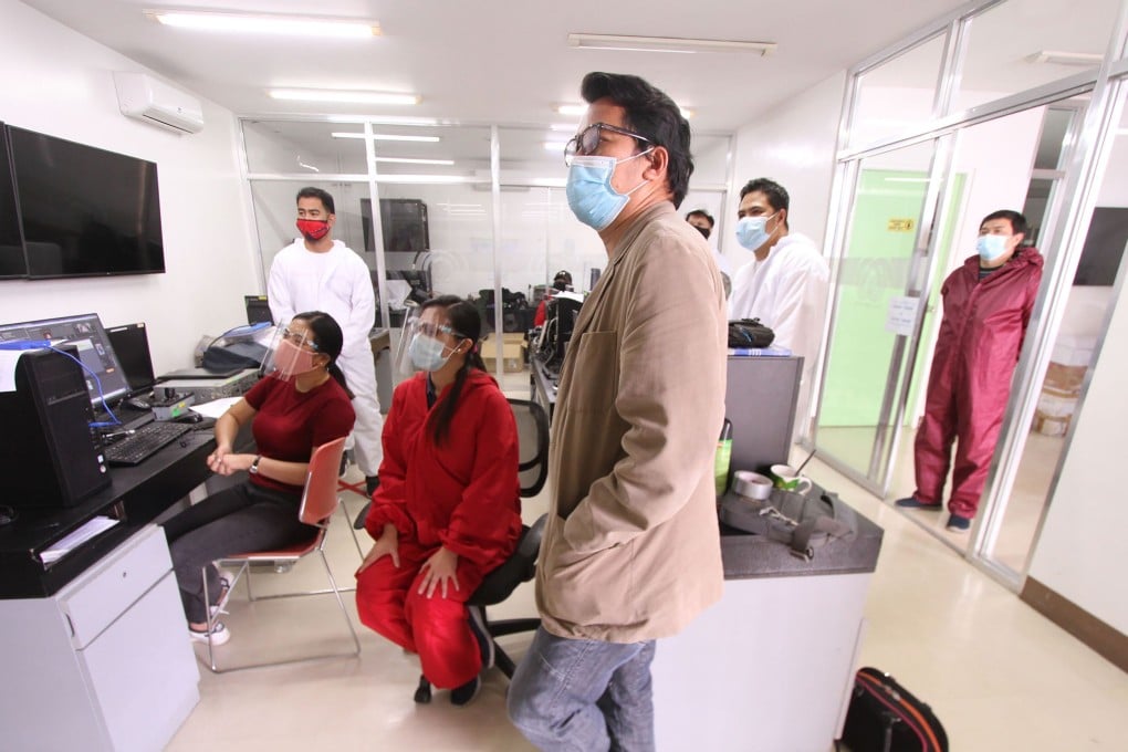 ABS-CBN employees watch a newscast during their last day of work at the regional studio in Baguio, north of Manila. Photo: AFP