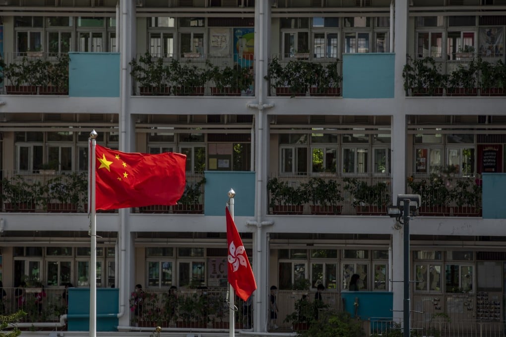 The flags of China and Hong Kong are flown at a school in Hong Kong. Photo: Bloomberg