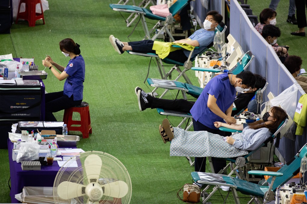 Recovered Covid-19 patients donate blood plasma in Daegu, South Korea. Photo: EPA-EFE