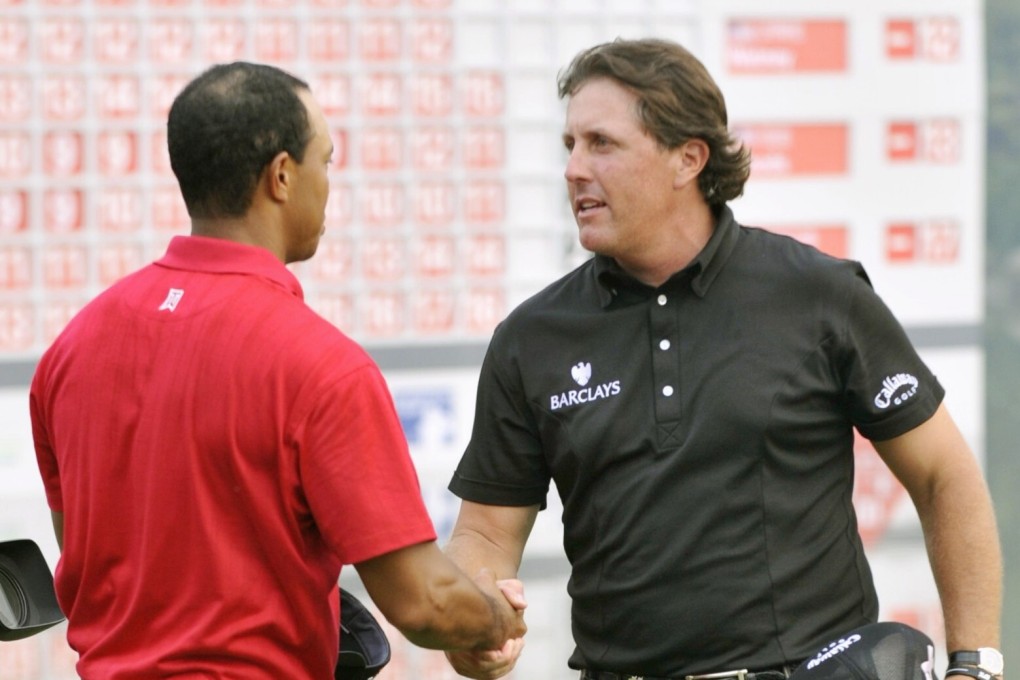 Phil Mickelson is congratulated by Tiger Woods after winning the WGC-HSBC Champions in Shanghai in 2009. The 2020 event has been cancelled due to the coronavirus. Photo: Kyodo