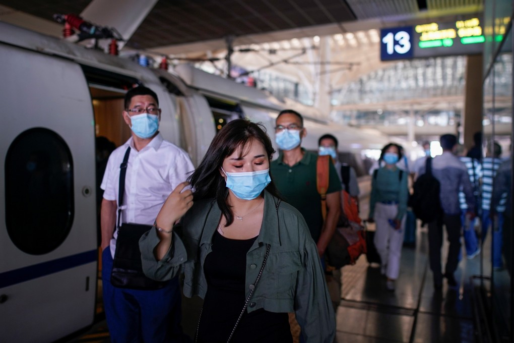 People arrive at Wuhan railway station on Wednesday. The new virus was first reported in the central Chinese city late last year. Photo: Reuters