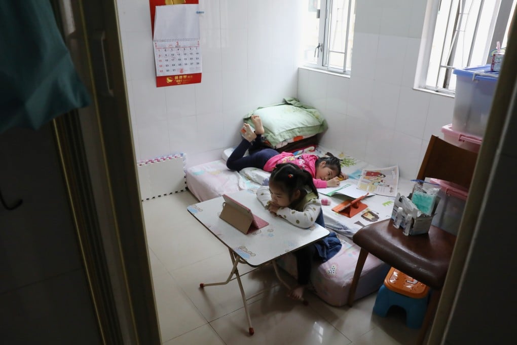 Children do their homework in a subdivided flat in Tsuen Wan. Many children in Hong Kong lack access to a digital device for online learning, which has been the norm for most of 2020. Photo: K.Y. Cheng