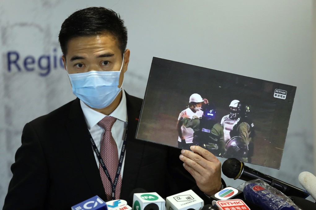 Police senior superintendent Chan Tin-chu holds up a photo from the night of the Yuen Long attack on July 21, 2019, during a press conference on August 26. Photo: Nora Tam