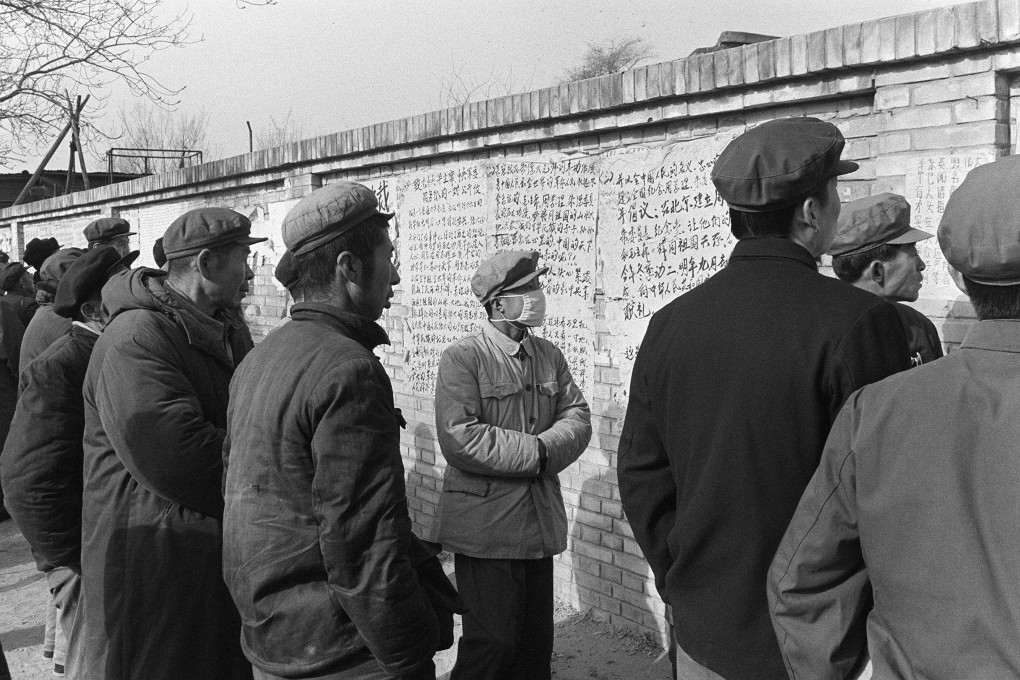 People read so-called big character posters hanging on the famous ‘Democracy Wall’ at the corner of Changan Avenue and Hsi Tan Street in Beijing in 1978. Photo: AFP