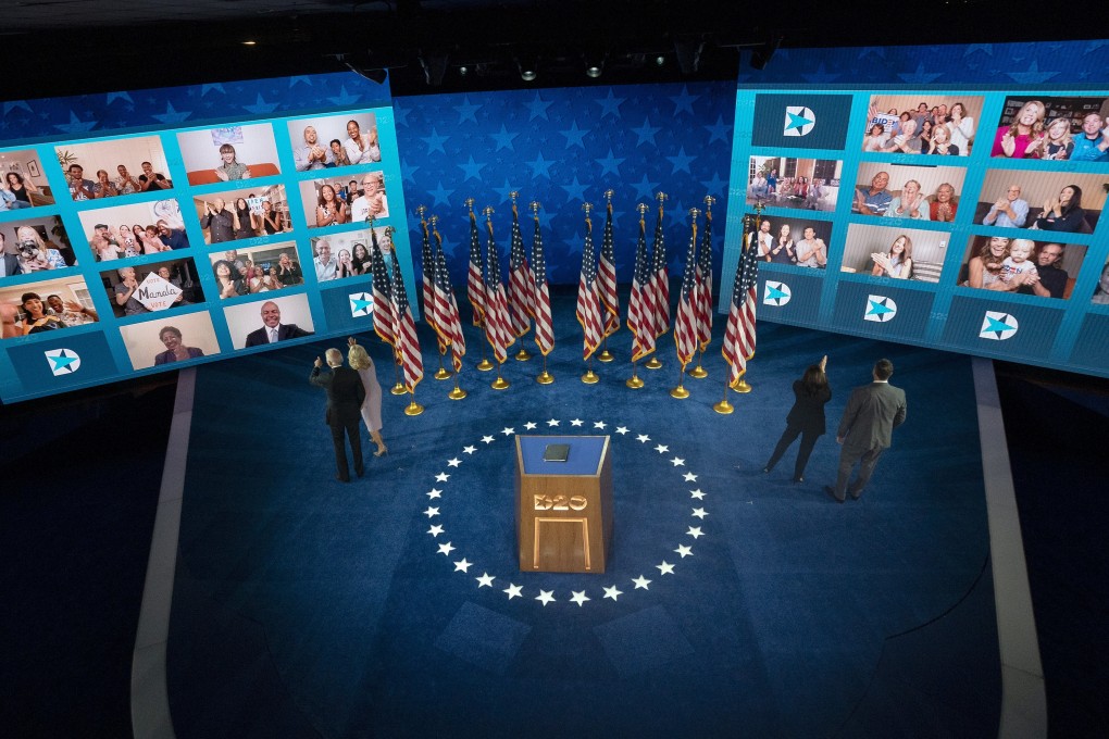 Former vice-president Joe Biden, the Democratic presidential nominee, and his wife, Jill (left) and Senator Kamala Harris, his vice-presidential nominee, and her husband, Douglas Emhoff, look at viewers tuned in to the virtual Democratic National Convention in Delaware on August 20. Photo: Bloomberg