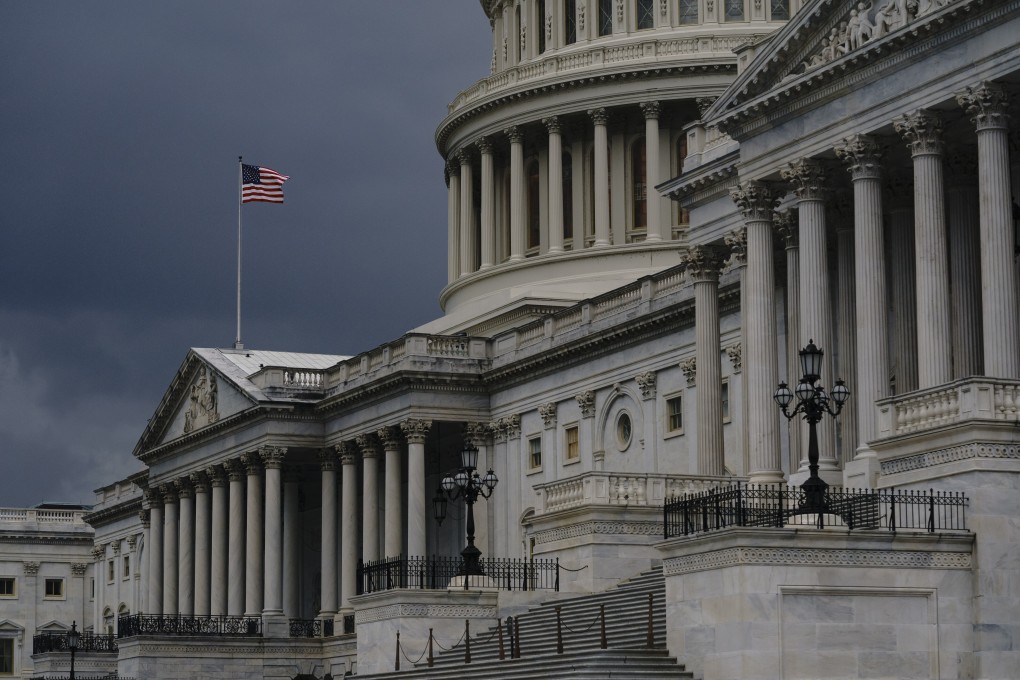 Dark clouds and heavy rain sweep over the US Capitol in Washington in August. Photo: AP