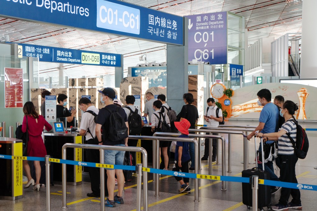 Travellers make their way to the domestic departures area at Beijing Capital International Airport, on Tuesday, August 25. Domestic travel demand is on the rise in China. Photo: Bloomberg