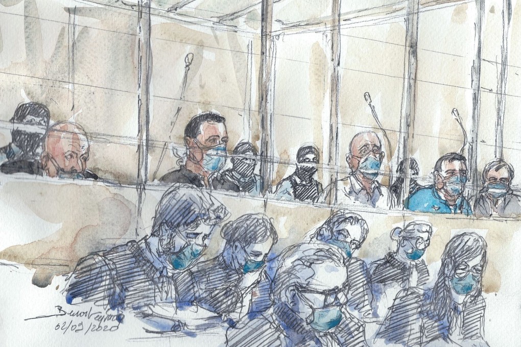 A courtroom sketch shows the accused and their lawyers in protective masks at the Paris courthouse on Wednesday, the first day of the Charlie Hebdo trial. Image: AFP