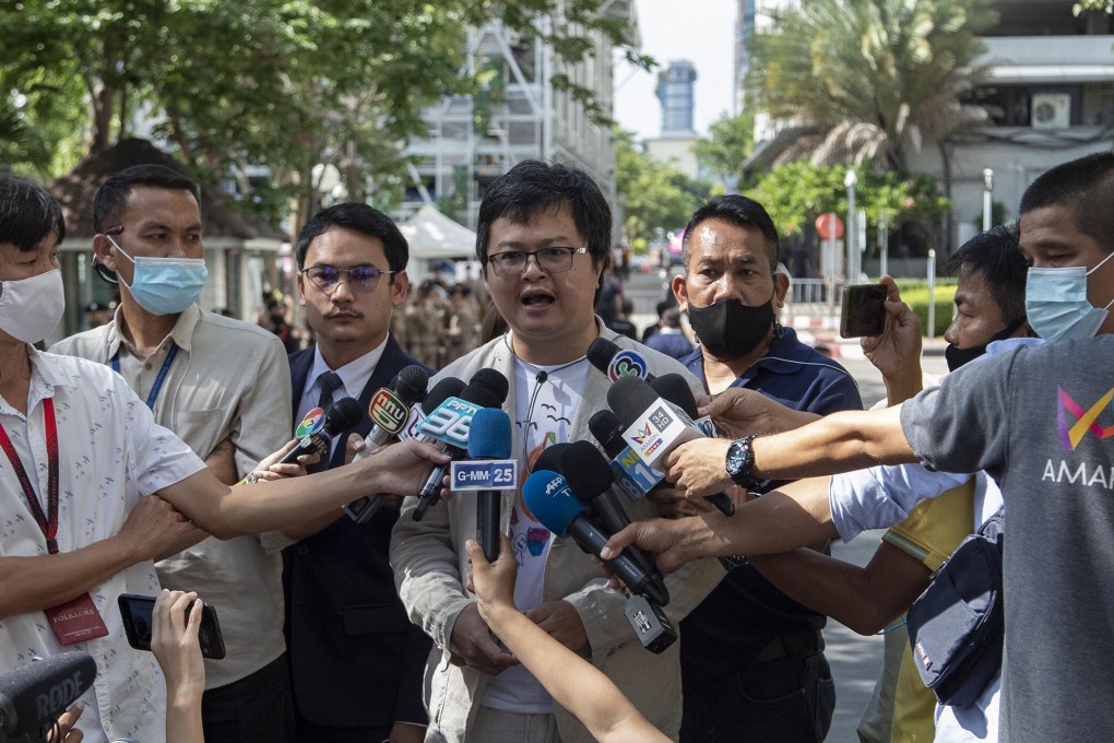 Pro-democracy activist and human rights lawyer Arnon Nampha, centre, speaks as he arrives at a courthouse in Bangkok on Thursday. Photo: AP