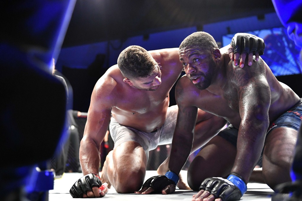 Alistair Overeem (left) consoles Walt Harris after their heavyweight bout during UFC Fight Night in Jacksonville, Florida in May. Photo: AFP